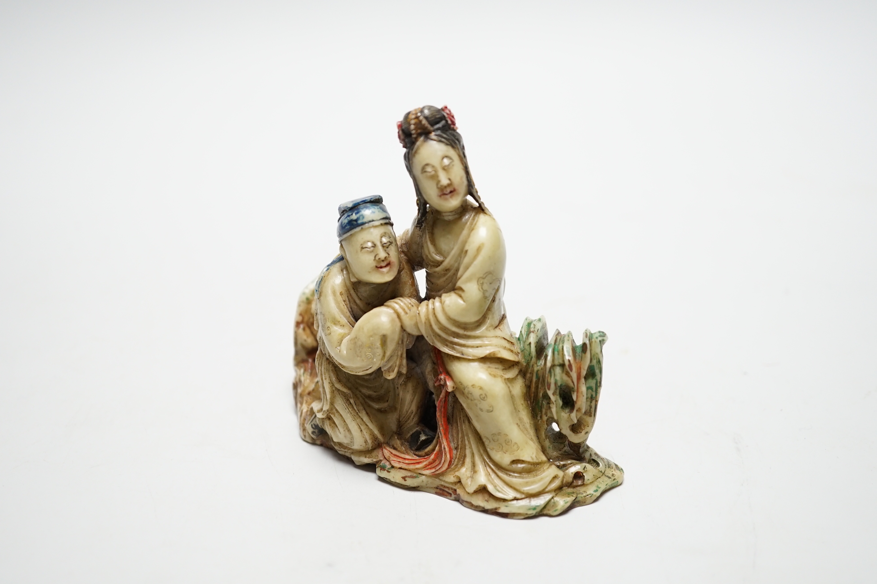 A Chinese soapstone carving - two figures, 19th/20th century, 9.5cm tall